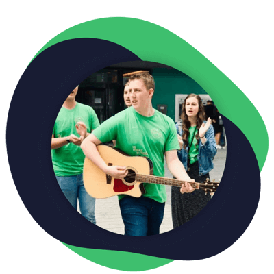 Andrew playing a guitar